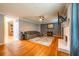Inviting living room featuring hardwood floors, a brick fireplace, and a comfortable gray sectional sofa at 2253 Carrington Dr, Ellenwood, GA 30294