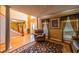 Elegant living area showcasing hardwood floors, a staircase, a grand entry, and stylish furnishings under a high ceiling at 2253 Carrington Dr, Ellenwood, GA 30294