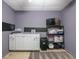 Well-organized storage room with white cabinetry, shelving, and chalkboard accent wall for a creative, functional space at 2253 Carrington Dr, Ellenwood, GA 30294