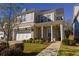 Charming brick home with a covered front porch and well-manicured landscaping at 2262 Haventree Ct, Lawrenceville, GA 30043