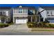 Charming two-story home featuring a brick facade, white trim, and a well-manicured front yard at 2262 Haventree Ct, Lawrenceville, GA 30043