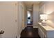 The hallway features hardwood floors and white trim at 2262 Haventree Ct, Lawrenceville, GA 30043