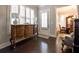 Hallway featuring a decorative cabinet and access to the dining room at 2262 Haventree Ct, Lawrenceville, GA 30043