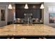 Bright kitchen with dark cabinets, granite countertops, stainless steel appliances, and a center island at 2262 Haventree Ct, Lawrenceville, GA 30043