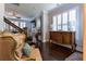 Comfortable living room features hardwood floors, modern ceiling fan and plantation shutters at 2262 Haventree Ct, Lawrenceville, GA 30043