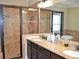 Bathroom features tile shower, tub, and granite counters at 1032 Willow Field Se Ln # 17, Marietta, GA 30067