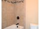 This bathroom features a shower-tub combination with decorative tile at 1032 Willow Field Se Ln # 17, Marietta, GA 30067