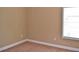 This bedroom features a light brown carpet and white window at 1032 Willow Field Se Ln # 17, Marietta, GA 30067