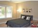 This bedroom features natural light from the window and decorative lamps at 1032 Willow Field Se Ln # 17, Marietta, GA 30067