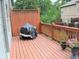 Wood deck with a grill and seating offering outdoor living space with a view of the landscaped surroundings at 1032 Willow Field Se Ln # 17, Marietta, GA 30067