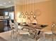 Bright dining area features stylish silver accents with modern light fixtures and hardwood flooring at 1032 Willow Field Se Ln # 17, Marietta, GA 30067