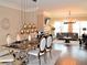 Sophisticated dining area open to the living room with modern pendant lights and luxurious furniture at 1032 Willow Field Se Ln # 17, Marietta, GA 30067