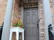 Charming front door with elegant pillars, complemented by a decorative floral arrangement and clear house number at 1032 Willow Field Se Ln # 17, Marietta, GA 30067