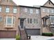 Charming brick townhome with stone accents, inviting entrance, and attached two-car garage at 1032 Willow Field Se Ln # 17, Marietta, GA 30067