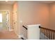 Hallway with carpet and wood railing at 1032 Willow Field Se Ln # 17, Marietta, GA 30067