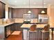 Well-appointed kitchen features stainless steel appliances, granite countertops and bar stool seating at 1032 Willow Field Se Ln # 17, Marietta, GA 30067
