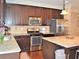 Updated kitchen with stainless steel appliances, granite countertops, and a center island at 1032 Willow Field Se Ln # 17, Marietta, GA 30067