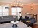 Elegant living room features hardwood floors, stylish chandelier, and comfortable seating at 1032 Willow Field Se Ln # 17, Marietta, GA 30067
