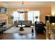Elegant living room features hardwood floors, stylish chandelier, and comfortable seating at 1032 Willow Field Se Ln # 17, Marietta, GA 30067