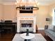 Elegant living room featuring a fireplace, modern lighting, and stylish furniture at 1032 Willow Field Se Ln # 17, Marietta, GA 30067