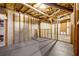 Unfinished basement featuring exposed framing and utilities; ready for customization at 1600 Dillwood Ct, Lithonia, GA 30058