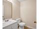 Bathroom with a vanity, toilet, and standard light fixtures at 1600 Dillwood Ct, Lithonia, GA 30058