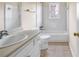 Bathroom featuring white tile walls and a vanity with a single sink at 1600 Dillwood Ct, Lithonia, GA 30058