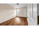 Neutral bedroom featuring vinyl floors and a single window and door at 1600 Dillwood Ct, Lithonia, GA 30058