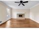 Inviting living room featuring laminate wood flooring, fireplace, and neutral-colored walls at 1600 Dillwood Ct, Lithonia, GA 30058