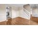 Open-concept living area featuring hardwood floors and neutral color palette at 1600 Dillwood Ct, Lithonia, GA 30058