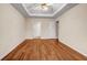 A bright main bedroom features a trey ceiling, and hardwood floor at 1600 Dillwood Ct, Lithonia, GA 30058