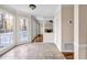 Light-filled sunroom featuring tiled floors and expansive windows showcasing outdoor views at 1600 Dillwood Ct, Lithonia, GA 30058