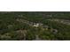 Aerial view of a home with a lush green lawn surrounded by trees and greenery in a residential neighborhood at , Cumming, GA 30041