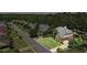 Aerial view of a house with mature trees, green lawn, and a gray roof in a residential area at , Cumming, GA 30041