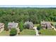 Aerial view of a residential area with mature trees, well-maintained lawns, and a beautiful mountain backdrop at , Cumming, GA 30041