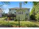 Backyard with lush lawn, deck, and mature trees at , Cumming, GA 30041