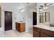 Bathroom with double sink vanity and large mirror, complemented by a tiled shower with glass door at , Cumming, GA 30041