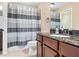 Bathroom featuring a granite vanity, tiled floor, and shower/tub combination with a curtain at , Cumming, GA 30041