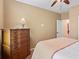 Neutral bedroom featuring a wooden dresser and a ceiling fan for added comfort at , Cumming, GA 30041
