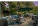 Well appointed back deck featuring patio furniture, built in grill, and outdoor TV at , Cumming, GA 30041