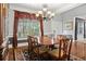 Elegant dining room featuring classic chandelier and beautiful window treatments at , Cumming, GA 30041