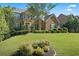 Well maintained two-story brick home with manicured lawn and mature landscaping at , Cumming, GA 30041