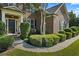Close-up of the home's inviting front entrance with lush landscaping at , Cumming, GA 30041