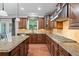 Gourmet kitchen features granite counters, custom cabinetry, and stainless steel appliances at , Cumming, GA 30041