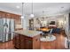 Spacious kitchen features a central island, stainless steel refrigerator, and an open floor plan at , Cumming, GA 30041