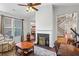 Open-concept living room with a fireplace, hardwood floors, and staircase views at , Cumming, GA 30041