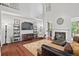 Spacious living room with a fireplace, entertainment center, and hardwood flooring at , Cumming, GA 30041