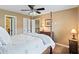 The main bedroom is well-appointed with a ceiling fan, carpeting, and natural light at , Cumming, GA 30041