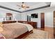 Spacious primary bedroom with a trey ceiling, dark trim, hardwood floors, dressers, and recessed lighting at , Cumming, GA 30041