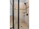 Modern bathroom featuring a seamless glass shower, neutral tile, a rain shower head, and built-in seating at , Cumming, GA 30041